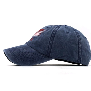 Close-up of vintage washed navy blue cotton baseball cap with USA flag embroidery