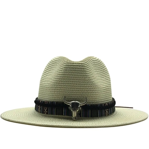 Western straw cowboy hat with ethnic band and silver bull skull ornament for sun protection