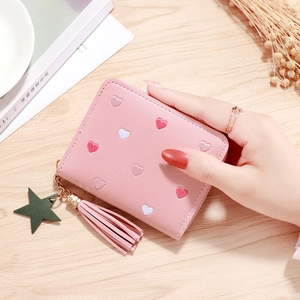 Pink faux leather short wallet with colorful embroidered hearts and star tassel charm