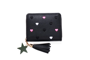 Detail of black PU leather wallet with heart embroidery, star pendant and tassel zipper