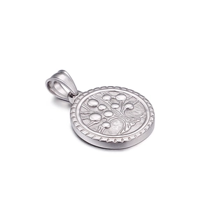 Polished silver titanium steel round Tree of Life pendant displayed at a side angle