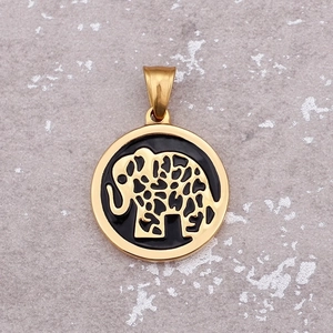 Golden elephant pendant with black enamel inlay and round openwork design on grey background