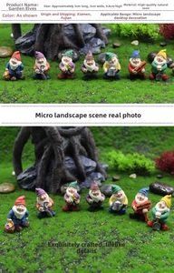 Detailed view of seven colorful miniature resin garden gnomes on moss landscape