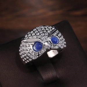 Retro S925 sterling silver owl ring with deep blue stone eyes and textured metal finish