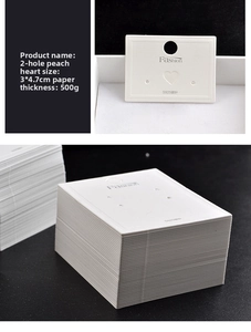 White fashion jewelry card for earrings with 2-hole heart design measuring 3x4.7cm
