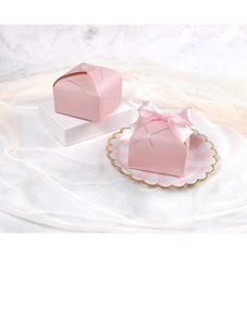 Detailed view of pink gift boxes with geometric silver patterns and elegant satin bows