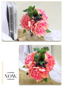 Detailed view of artificial peony bouquet with pink-orange gradient and berries