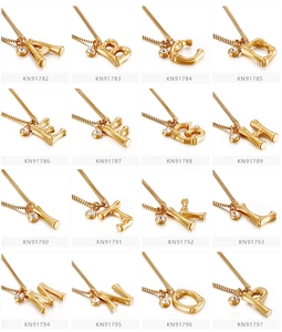 Detail of bamboo texture gold 26-letter initial necklaces with sparkling crystal charms