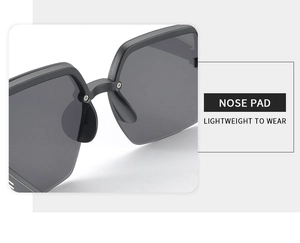 Macro shot of comfortable integrated nose pads on black lightweight sunglasses