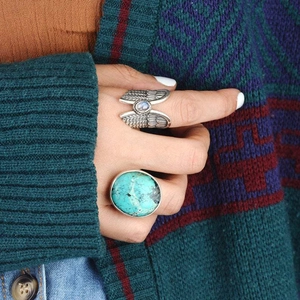 Vintage silver angel wing ring with moonstone and turquoise on model hand