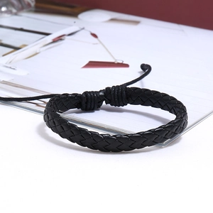 Close-up of black braided leather multi-layer bracelet with adjustable cord detail