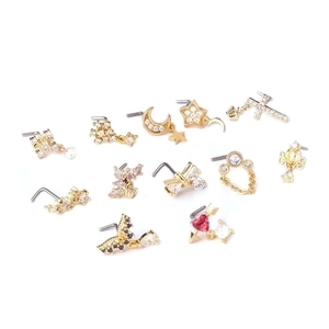 Collection of 13 gold titanium steel nose studs with assorted zircon crystal shapes