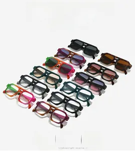Multiple colorful double bridge oversized sunglasses and frames in a row