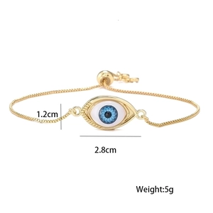 Adjustable gold Evil Eye bracelet featuring blue spiral pupil and white enamel detail