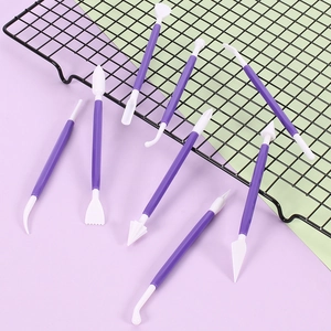 Close-up of 8-piece purple clay sculpting set with dual-head white plastic carving tips