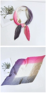 Detail of gradient pink and purple pleated silk scarf with fine accordion fold texture