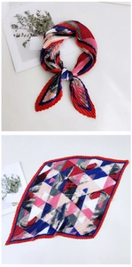 Macro detail of pleated silk scarf featuring colorful geometric patterns and red wavy edges