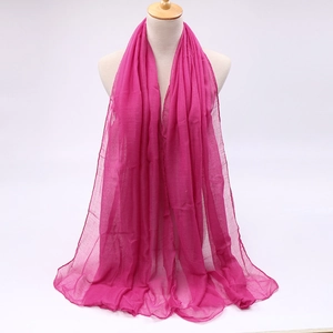 Detailed texture of rose pink voile scarf showing fabric drape and sheer material quality