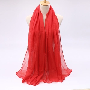 Detail of red candy color voile scarf showing lightweight texture and soft drape
