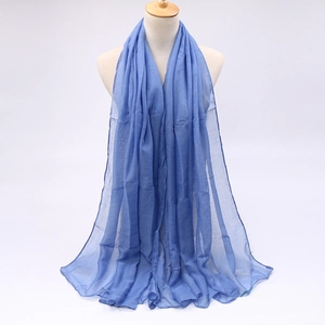 Close-up of light blue candy color sheer scarf texture on a mannequin display
