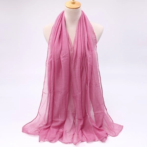 Detail of soft dusty rose voile scarf showing breathable sheer texture and hemmed edges
