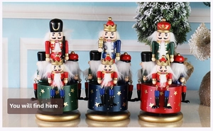 Three Nutcracker wooden music boxes with hand-painted soldiers and gold star details