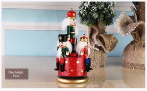 Detailed view of handcrafted wooden nutcracker music box with festive soldier figures