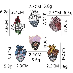 Creative anatomical heart enamel pins set with size details on white background