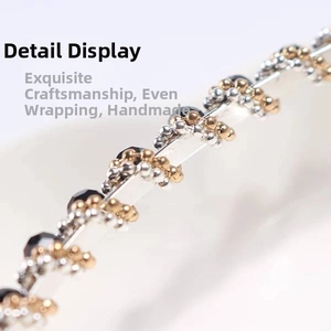 Macro shot of handcrafted crystal headband with gold beads and black faceted stones