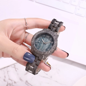 Detail of grey bamboo texture watch with teal wood grain dial and matching link strap