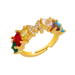 Detail of adjustable gold letter M ring with colorful crystals and pave zircons