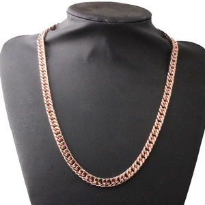Close-up of 8mm rose gold Cuban link necklace displayed on a black mannequin bust