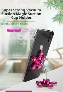 Macro shot of pink flexible magic suction cup phone stand attached to smartphone back