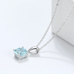 925 sterling silver necklace featuring a round light blue zircon solitaire pendant