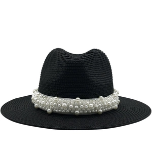 Black straw jazz hat with pearl band for outdoor summer sun protection and beach vacation style