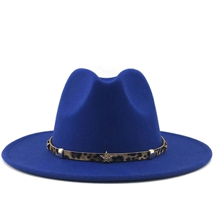 Dark blue wide brim fedora hat with leopard print band and gold star metal accents