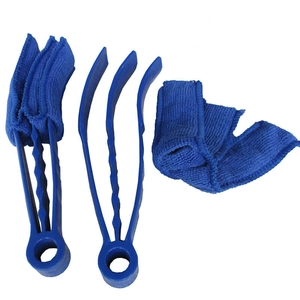 Detail of blue microfiber shutter cleaner tool with three-prong brush on white background