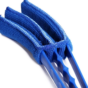 Close-up of blue microfiber shutter cleaning brush tool with a durable plastic handle