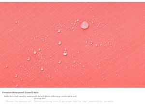Close-up of waterproof Oxford fabric coating with water droplets on coral pink travel bag