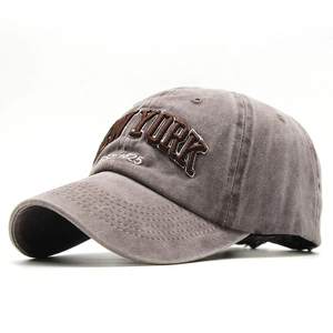 Detail of vintage washed cotton baseball cap with New York 3D embroidery textures