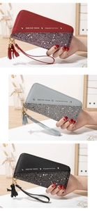 Detail of color-blocked long wallet with star sequins and tassels in various colors