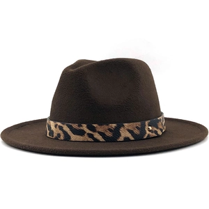 Detail of dark brown wool fedora with leopard print band and golden rivet accent