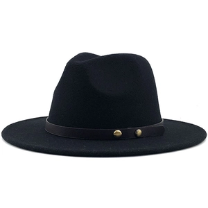 Detailed view of black wool fedora featuring dark brown leather strap with gold studs