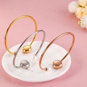 Three-color pearl and evil eye open cuff bracelets in gold, silver, and rose gold finish