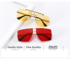 Detail of rimless oversized sunglasses with yellow and red lenses and metal bridge
