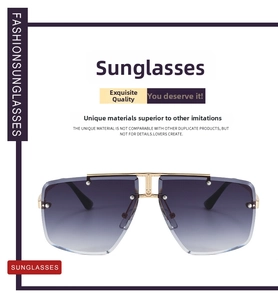 Close-up of rimless gradient purple oversized sunglasses with golden metal bridge and frame