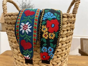 Detailed embroidery on bohemian style wide headbands with colorful floral patterns