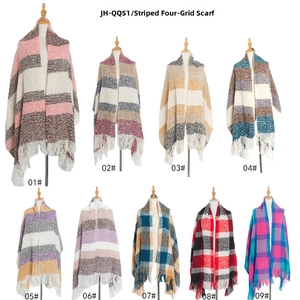 Detail shot of nine assorted plaid scarves with soft fringes in various color patterns