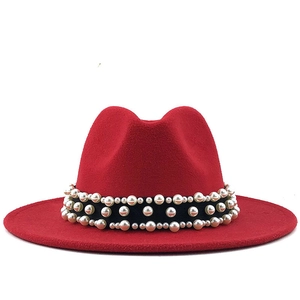 Red wool felt fedora with wide flat brim and elegant pearl band decoration for women