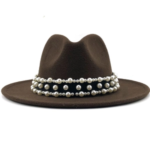 Detailed view of the dark brown wide brim fedora with elegant triple pearl decorative band